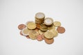 Pile of Euro and cents coins of various denominations on a white desk, shallow depth of field Royalty Free Stock Photo