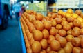 Heap of farm fresh Oranges kept on a street side cart for sale in a Indian fruit market Royalty Free Stock Photo