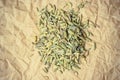 Heap of fennel dill seeds on paper surface