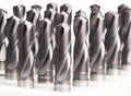 Heap of finished metal drills Royalty Free Stock Photo