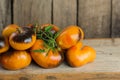 Heap of fresh brown and yellow tomatoes. Tomatoes Alices Dream on the old wooden table Royalty Free Stock Photo