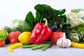 Heap of fresh fruits and vegetables on wooden background.