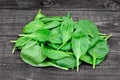 Heap of fresh green baby spinach on table