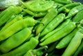 Heap of fresh green chili peppers for sale at the market