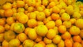 heap of fresh mandarin oranges. ugly fruit.