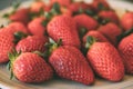 Heap of fresh and organic strawberries as background. Close up view of ripe strawberries.