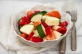heap of fresh raw vegetable cubes isolated in beautiful bowl Royalty Free Stock Photo
