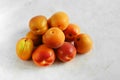 Heap of fresh ripe apricots on a table made of natural marble, copy space. Apricots are rich in vitamins and minerals such as: Royalty Free Stock Photo
