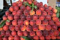 Heap of fresh ripe peaches in a market