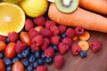 Heap of fresh tropical fruits colorful vegetables summer healthy food / Many ripe fruit mixed on wooden background