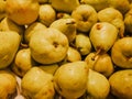 Heap of fresh yellow pears for sale in the market close up top view Royalty Free Stock Photo