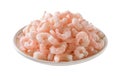 Heap of frozen boiled shrimps on a plate cutout. Plate of cooked peeled prawn tails isolated on a white background. Frozen shrimps Royalty Free Stock Photo