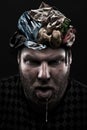 Heap of garbage inside silly man head Royalty Free Stock Photo