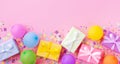 Heap of gift or present boxes, colorful balloons and confetti on pink pastel table top view. Birthday party background. Banner Royalty Free Stock Photo