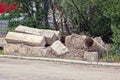 Heap of gray garbage from concrete blocks of stones pipes by the road