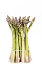 Heap of green asparagus vegetables isolated on white background Royalty Free Stock Photo