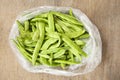 Heap green beans on wooden background. Royalty Free Stock Photo
