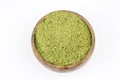 Heap of green henna powder isolated on white background
