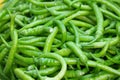 Heap of green hot chili pepper close up.