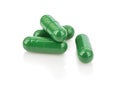 Heap of green medical capsules