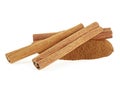 Heap of ground cinnamon and cinnamon sticks isolated on white background. Cassia