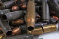 Heap of gun bullets. Weapon Cartridge case sleeve background texture, 7.65, and 9mm. Weapon cartridge sleeves.Gun bullet pattern c