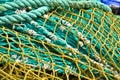A heap, a huddle of traditional fishing equipement with green nets and orange buoys Royalty Free Stock Photo