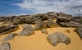 Heap of huge stones lie on a sand Royalty Free Stock Photo