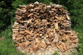 Heap or island of firewood. Alternative and cheap energy source for heating. Heating season Royalty Free Stock Photo