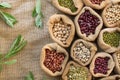 Heap of Legumes seeds with nut leaf top view