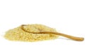 Heap of long parboiled rice and wooden spoon isolated on white background Royalty Free Stock Photo