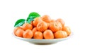 Heap of mandarin in bamboo plate isolated