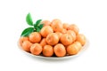 Heap of mandarin in bamboo plate isolated