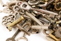 A heap of many different old keys are lying in the whiite studio Royalty Free Stock Photo