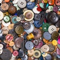 Heap of many various buttons close up on blue