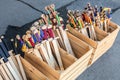 Heap of many wooden toy medieval swords in boxes at souvenir shop. Handmade children& x27;s decorative weapon Royalty Free Stock Photo