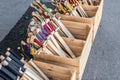 Heap of many wooden toy medieval swords in boxes at souvenir shop. Handmade children& x27;s decorative weapon Royalty Free Stock Photo