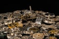 Heap of metal internal parts of an old clock. Dial, clockwork, bracelet, gears, cogwheels on black studio background