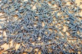 A heap of metal screws an a plywood sheet Royalty Free Stock Photo