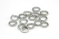 Heap of 8mm split spring washers on white background