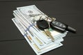 Heap of money and car key Royalty Free Stock Photo