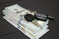 Heap of money and car key Royalty Free Stock Photo