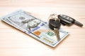 Heap of money and car key Royalty Free Stock Photo