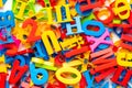 Heap of multicolored magnetic plastic letters, top view Royalty Free Stock Photo