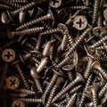 Heap of new black self-tapping screws close-up Royalty Free Stock Photo
