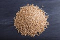 Heap of oats grains isolated on black background, top view Royalty Free Stock Photo