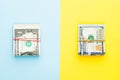 Heap of one dollars banknote and modern hundred us dollar bills on blue and yellow background. Commercial money investment profit Royalty Free Stock Photo