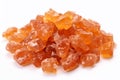 Heap of orange, amber colored raw dried gum arabic pieces