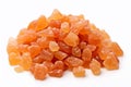 Heap of orange, amber colored raw dried gum arabic pieces