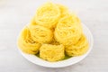 Heap of pasta capellini in white plate on table Royalty Free Stock Photo